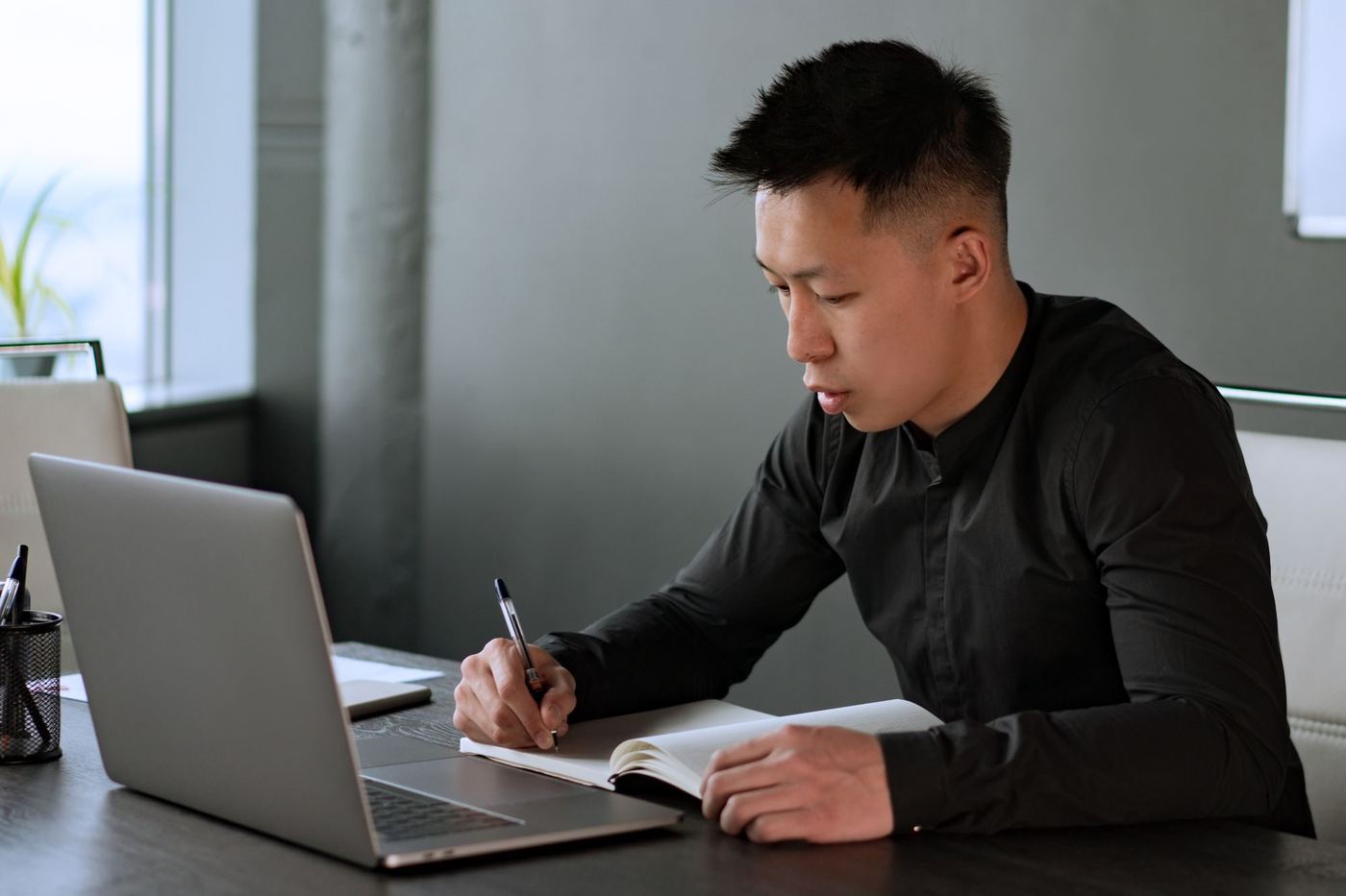 An engineer planning work at a laptop